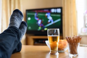 Feet on table watching TV