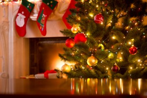 Christmas tree by fireplace