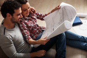 Couple looking at blueprints