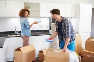 Couple unpacking in new home