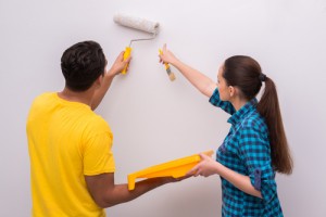 Couple painting home