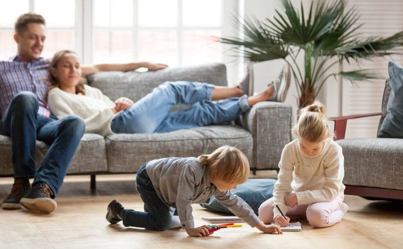 family enjoying living room with kid with no tv